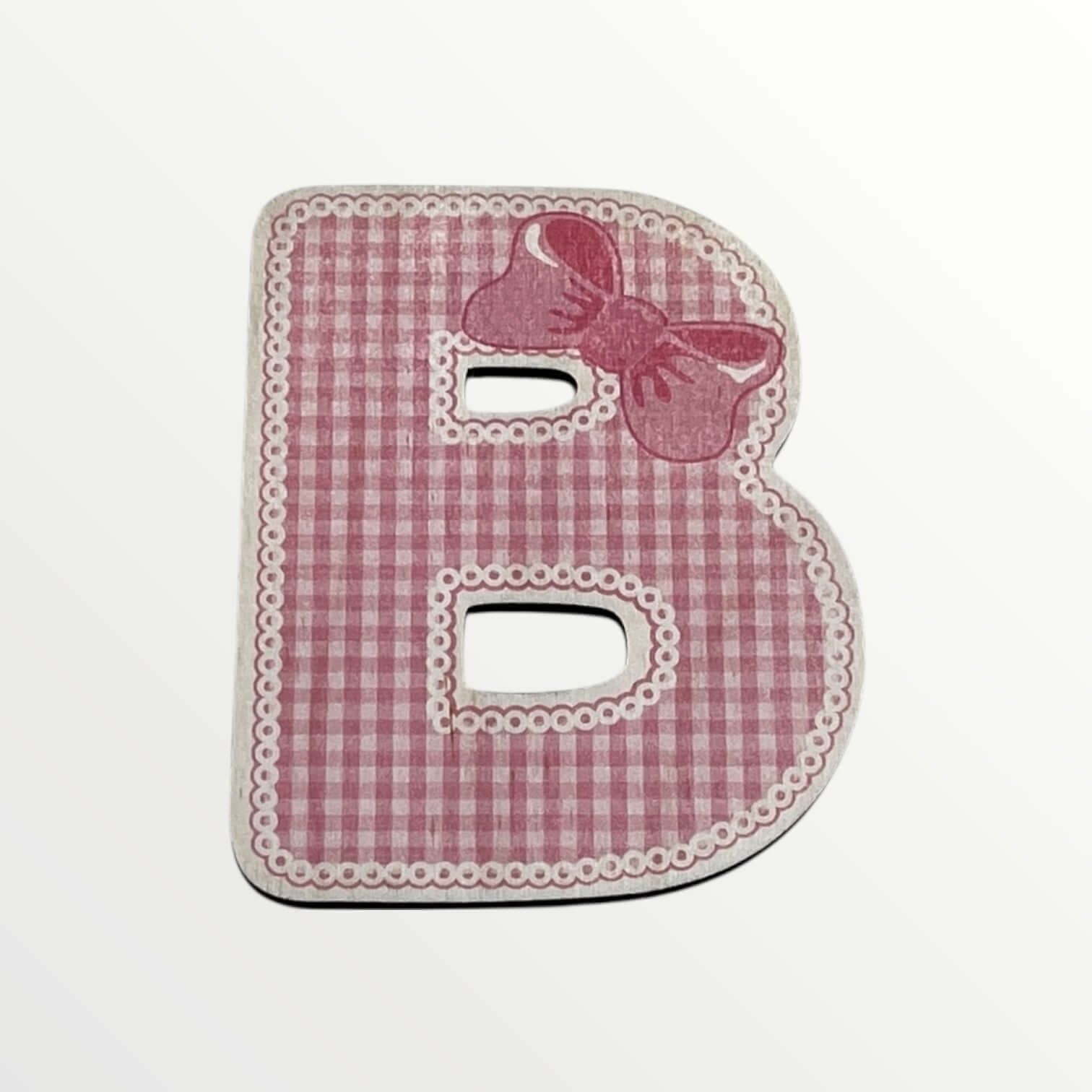 Pink checkered letter 'B' with a bow on a white background