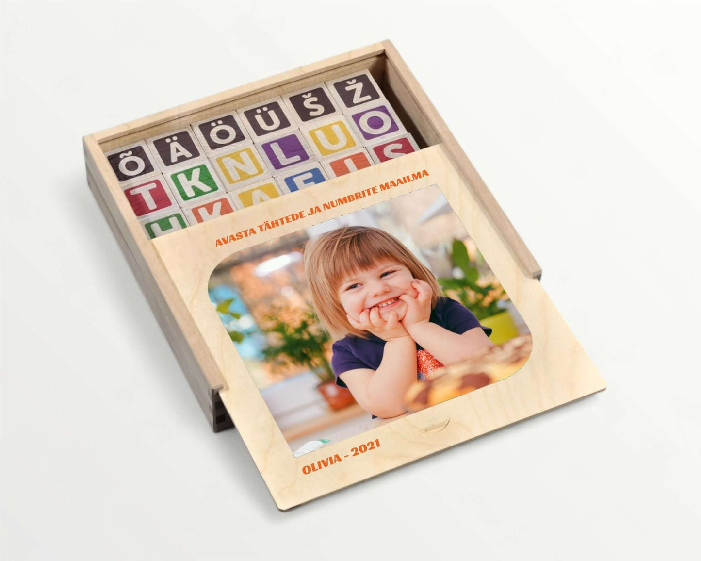 ABC-123 Wooden blocks - 36 pcs in a wooden box with colorful letters and a smiling toddler.
