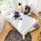 Lahe - Bed - 140x200 cm - White in a stylish room with a person playing guitar and vinyl records on the bed.