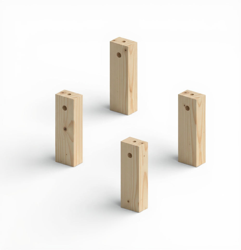 Four wooden blocks of different sizes on a white background