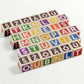 ABC-123 Wooden blocks - 36 pcs arranged with colorful letters on a white background.