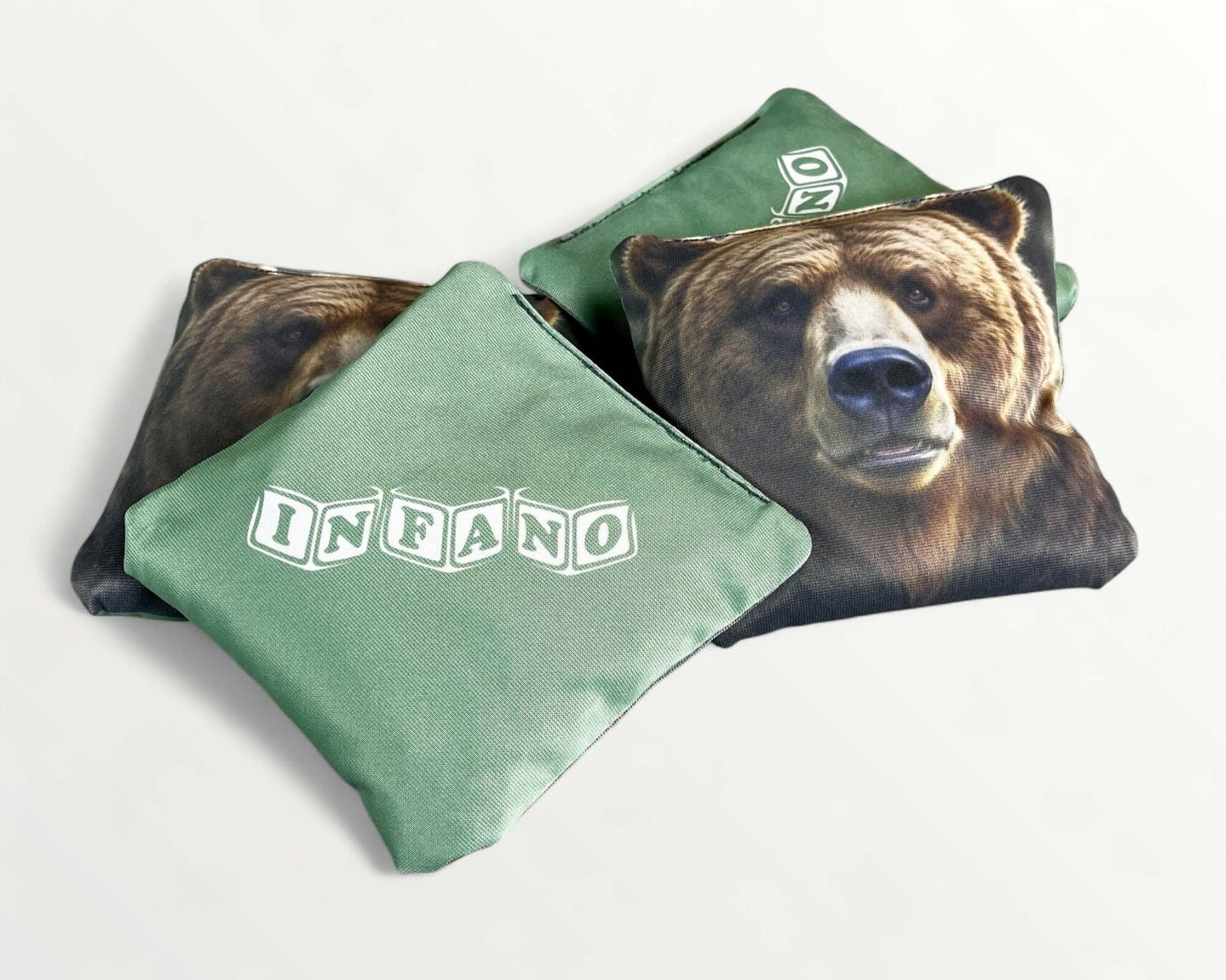 Cornhole Bags – Set of 4 featuring bear design with 'INFANO' logo on green fabric.