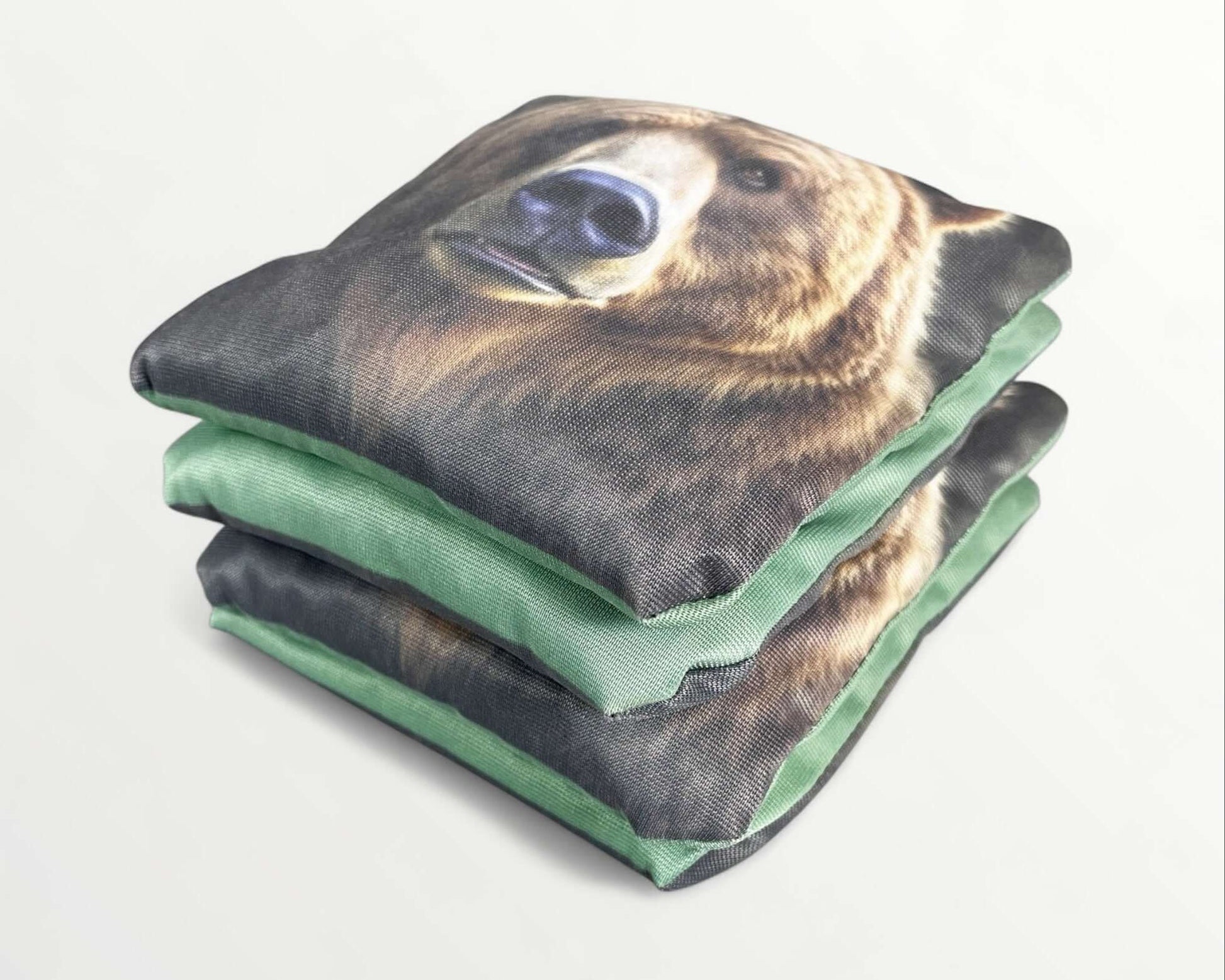 Cornhole Bags – Set of 4 featuring a bear design with green backing, perfect for outdoor games.