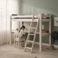 Lahe - High bed with slant ladder and corner table top - 90x200 cm - White in a stylish child's room with a desk.
