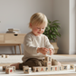 Nature Alphabet Blocks - German alphabet - Set of 30 with a child playing and learning letters.