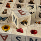 Nature Alphabet Blocks - Nordic Letter Set - Set of 30 with animal images and letters on wooden blocks.