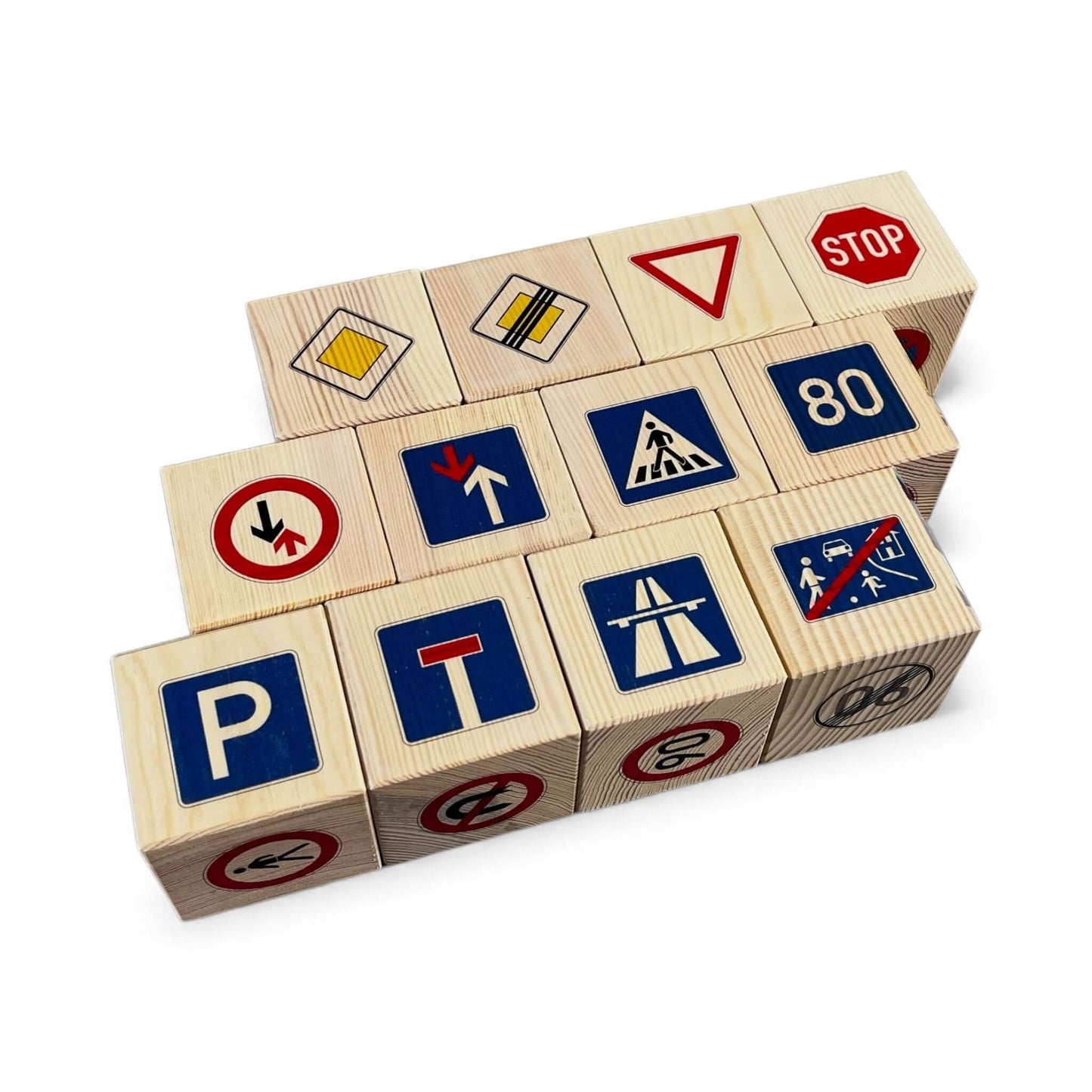 Wooden blocks with road sign designs on a white background