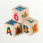 Wooden letter blocks - finnish alphabet - 30 pcs, featuring colorful letters and playful illustrations.