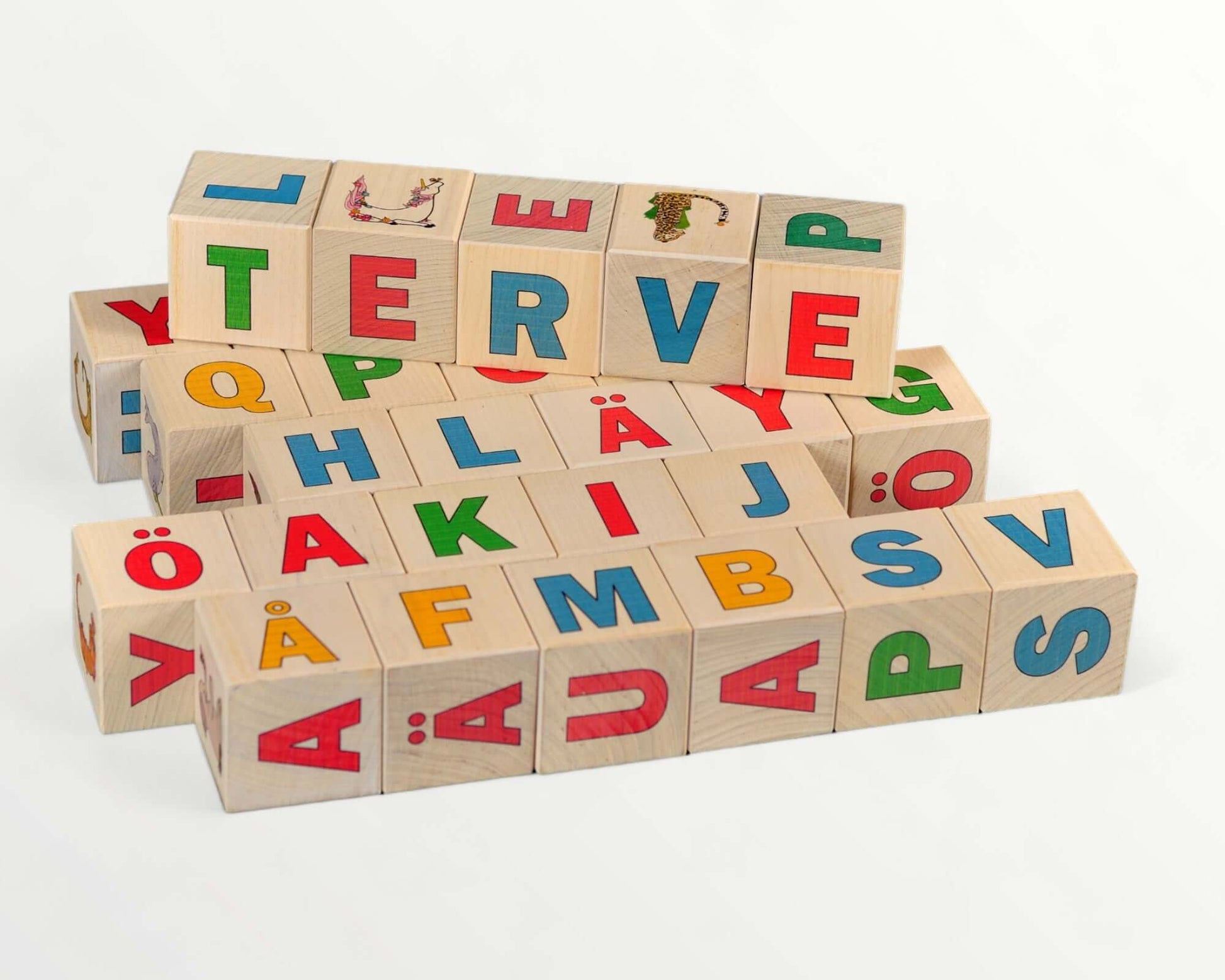 Wooden letter blocks - finnish alphabet - 30 pcs displayed in a colorful stack with Finnish letters and illustrations.
