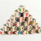 Wooden letter blocks - russian alphabet - 30 pcs displayed in a pyramid with colorful images and letters.