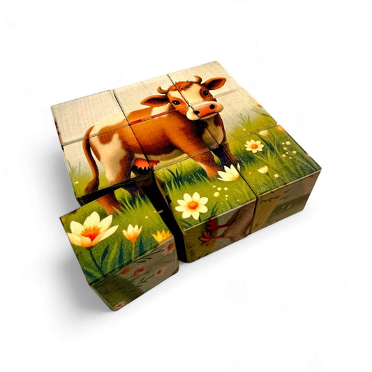 Wooden Puzzle Cubes – Farm Life featuring blocks depicting a friendly cow surrounded by flowers and grass.