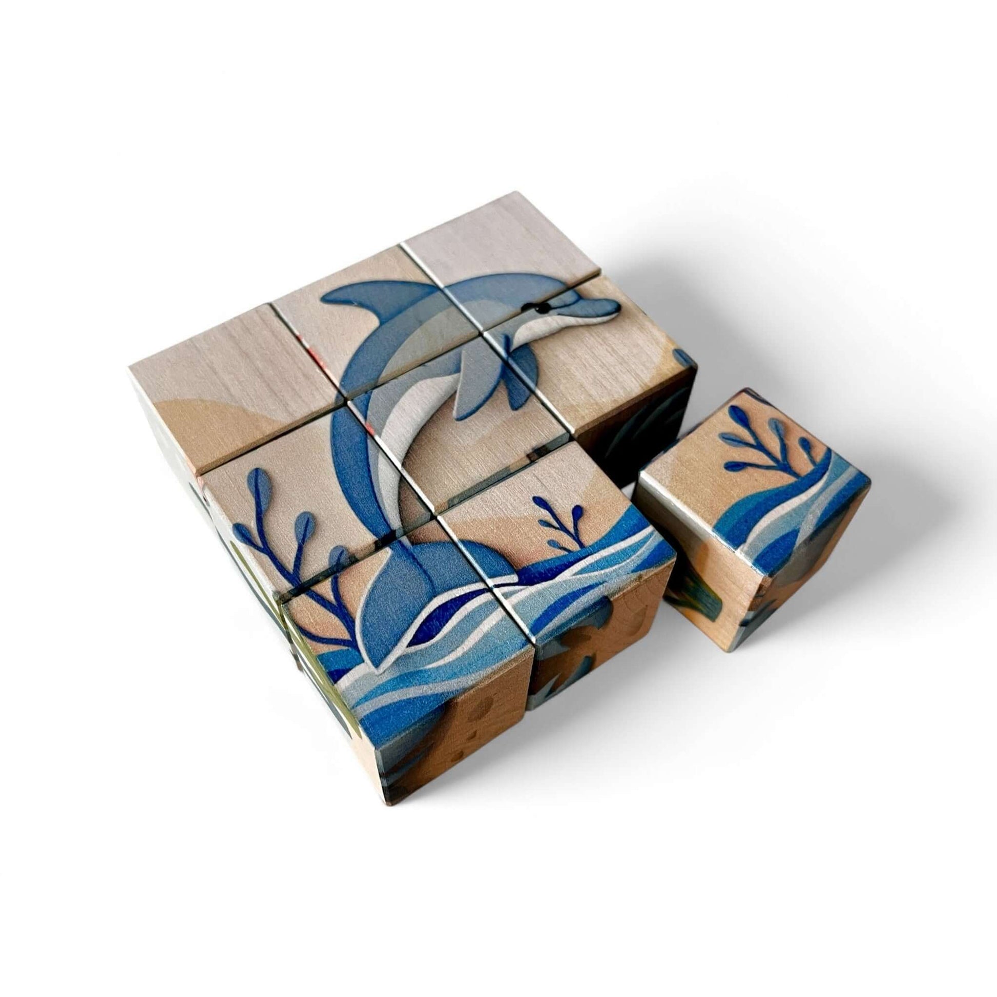 Wooden Puzzle Cubes – Underwater World featuring dolphin and ocean waves, ideal for imaginative play and skill development.