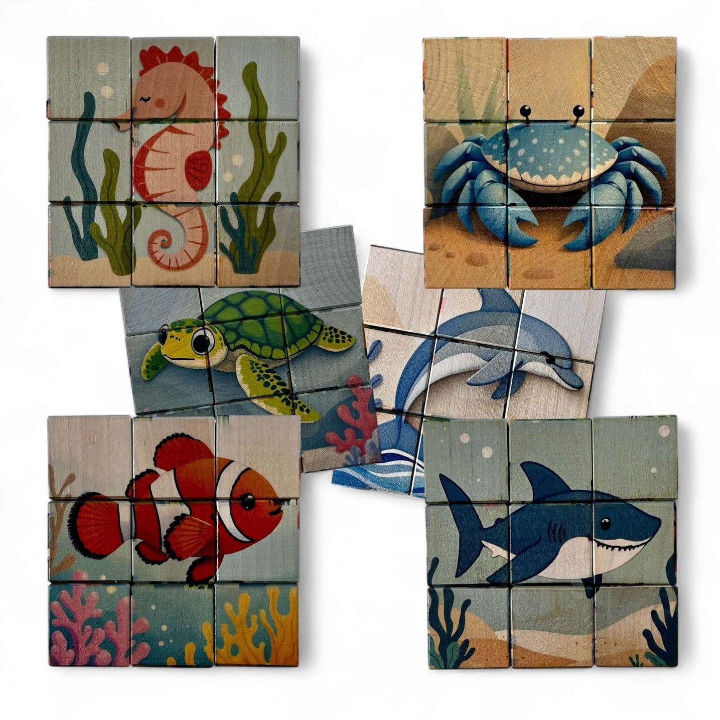 Wooden Puzzle Cubes – Underwater World featuring sea creatures like seahorse, crab, turtle, dolphin, clownfish, and shark