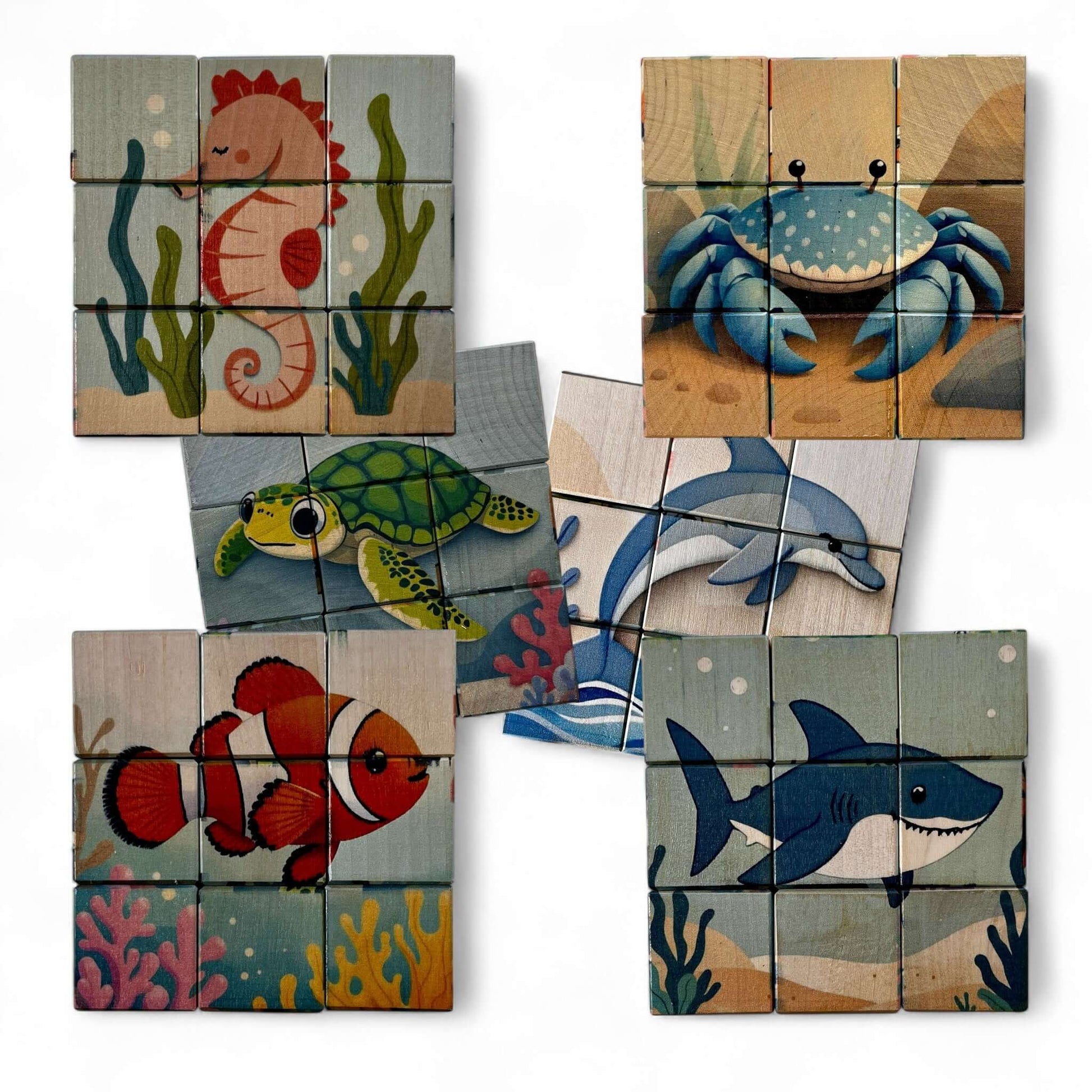 Wooden Puzzle Cubes – Underwater World featuring sea creatures like seahorse, crab, turtle, dolphin, clownfish, and shark