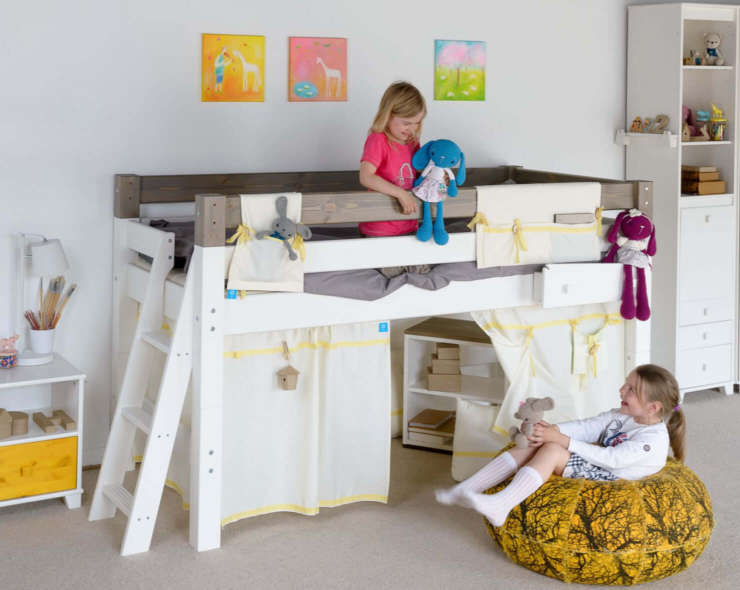 Lahe - Half high bed with slant ladder end mount - 90x200 cm - White in a children's room with kids playing.