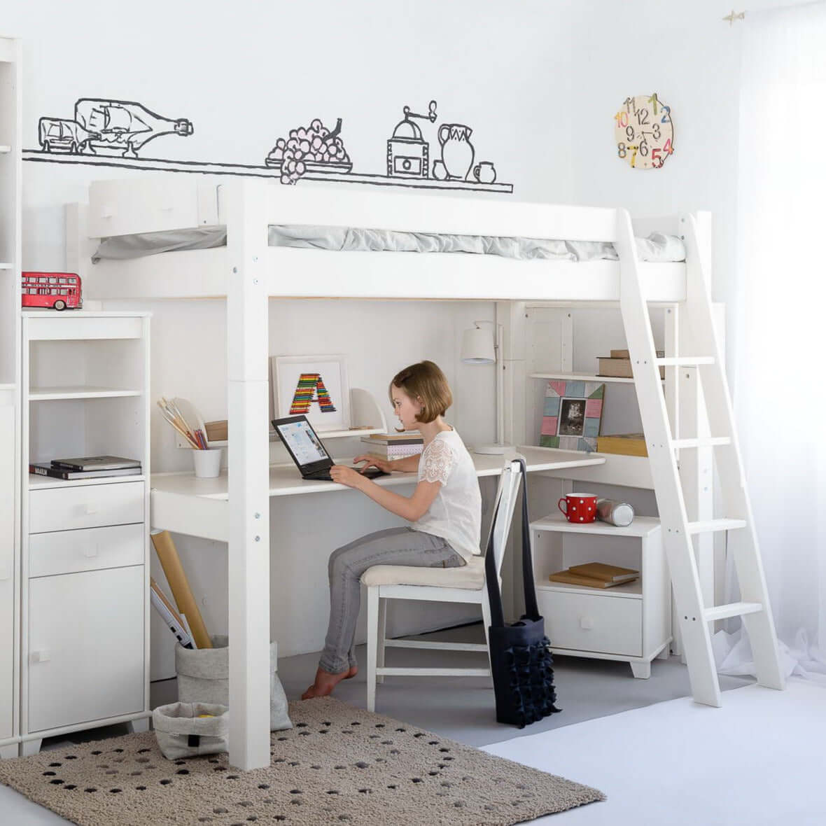Lahe - High bed with slant ladder - 90x200 cm - White in a stylish kids' room with a desk and creative decor.